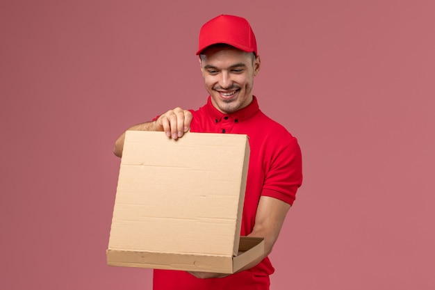 Download Free Photo | Front view male courier in red uniform and ...