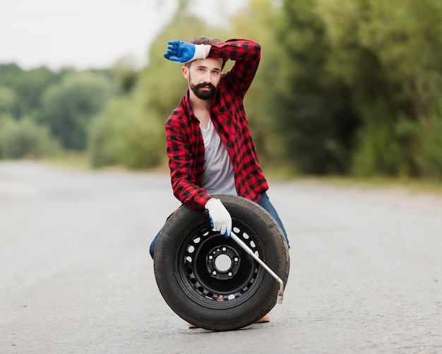 Front view of man wiping off sweat Free Photo