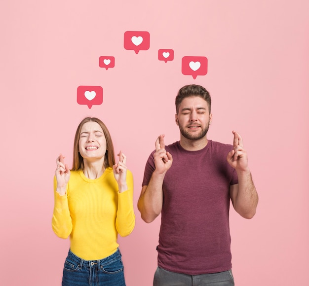 Free Photo | Front view of man and woman making a wish