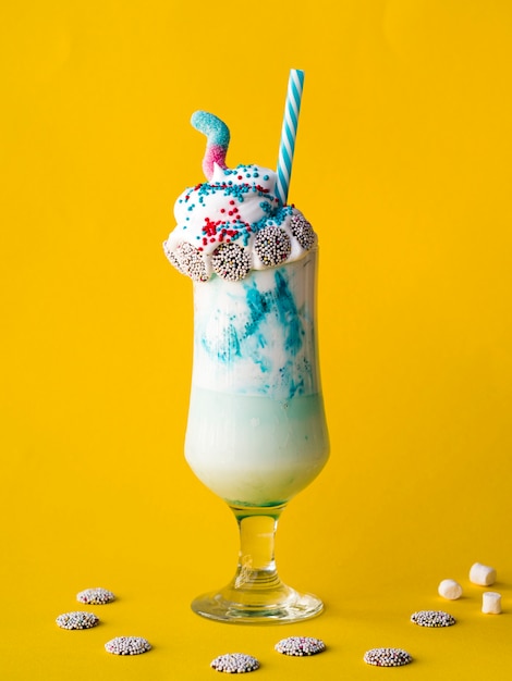 Free Photo | Front view of milkshake on yellow background