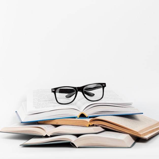 Front view open books with glasses Free Photo