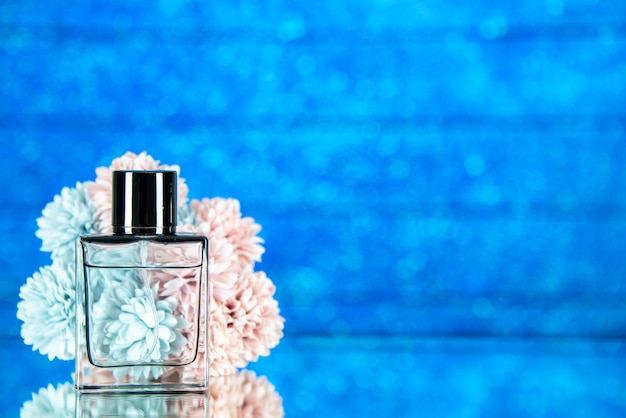 Free Photo | Front view perfume bottle flowers on blue background with ...