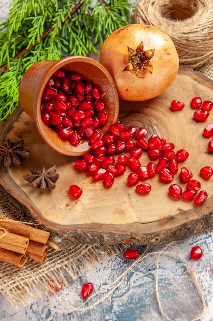 Free Photo | Front view pomegranates scattered pomegranate seeds in ...