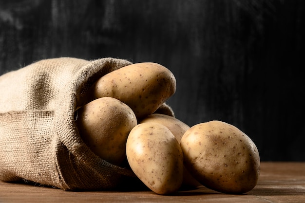 Front view of potatoes in burlap sack Free Photo