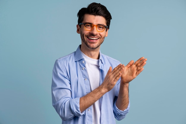 Free Photo | Front view of smiley handsome man with glasses