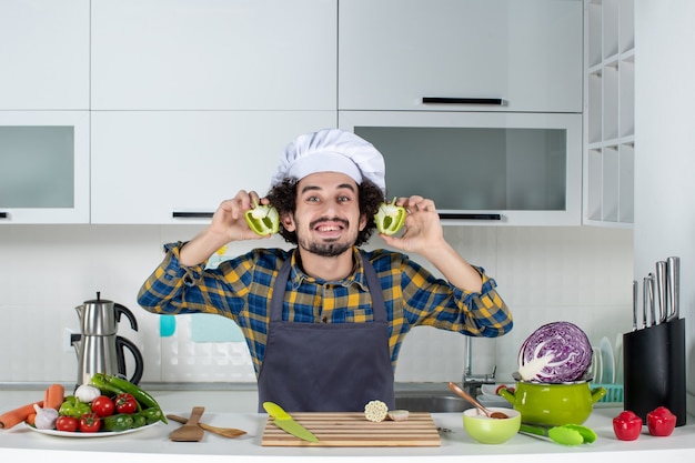 Free Photo | Front view of smiling male chef with fresh vegetables and ...