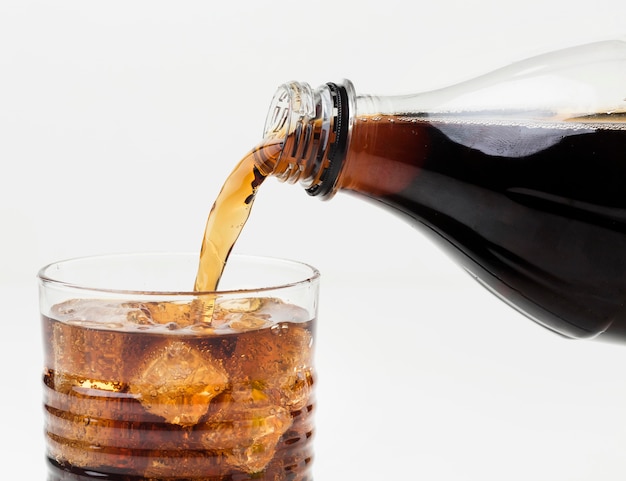 Free Photo Front View Of Soft Drink Being Poured In Glass