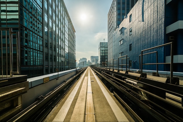 Premium Photo | Front view of train in modern city. straight rail with ...