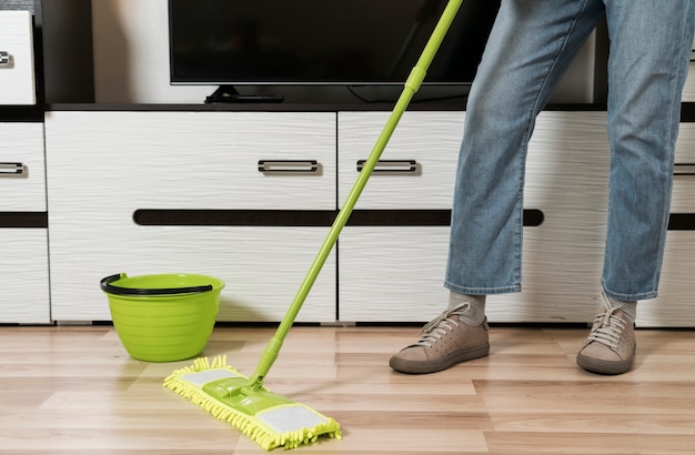 Premium Photo | Front view of woman mopping the floor