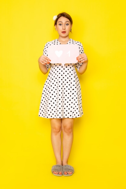 yellow dress with white polka dots