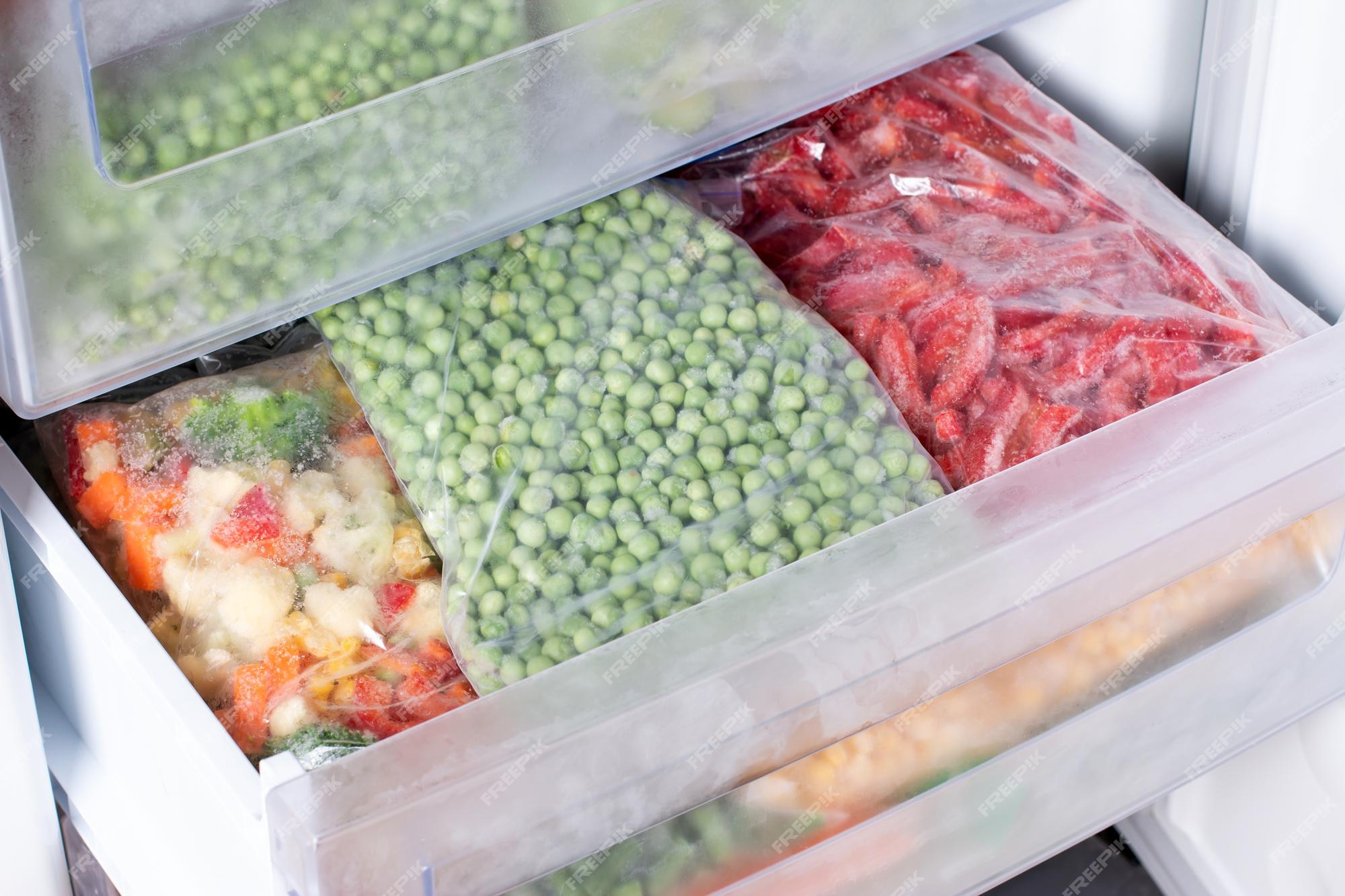 Premium Photo Frozen green peas in the freezer