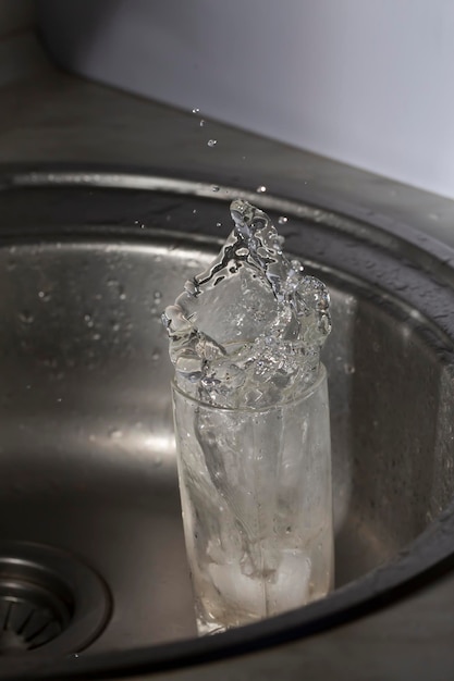 Premium Photo | Frozen splash of water in a glass, close-up, macro