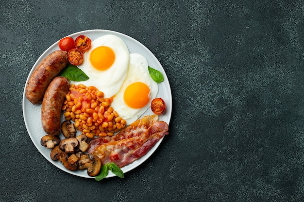Premium Photo | Full english breakfast on a plate with fried eggs