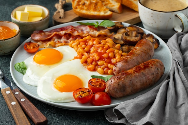 Premium Photo | Full english breakfast on a plate with fried eggs