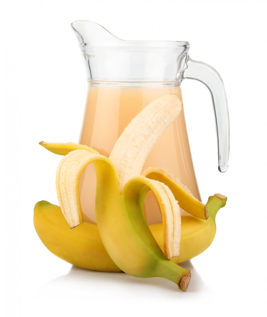 Premium Photo | Full jug of banana juice and fruits isolated