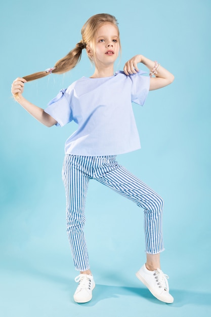 Premium Photo | Full-length portrait of a beautiful girl in blue ...