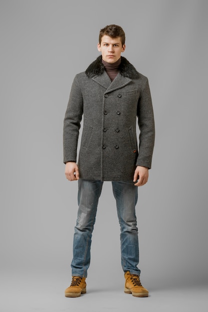 Premium Photo | Full length portrait of handsome man in warm coat ...