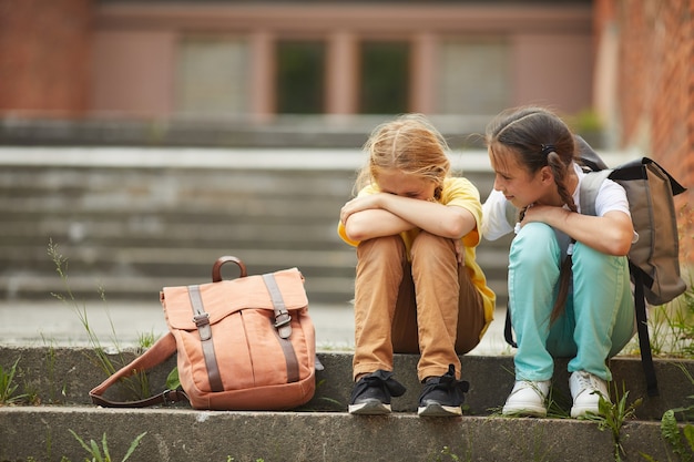 Premium Photo | Full length portrait of teenage schoolgirl crying while ...