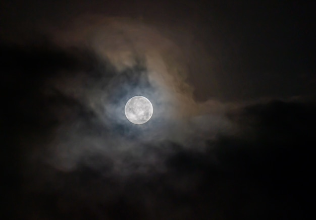 Premium Photo | Full moon through the clouds on a cold winter morning!