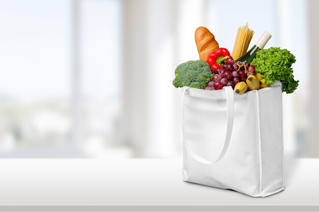 Premium Photo | Full shopping bag, isolated over background