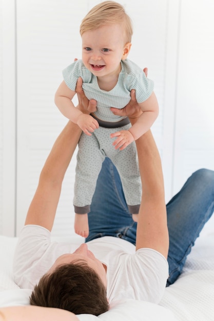 Free Photo | Full shot father holding toddler