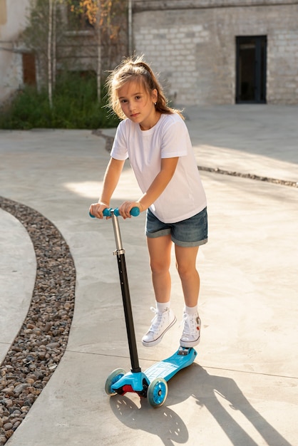 girl riding a scooter