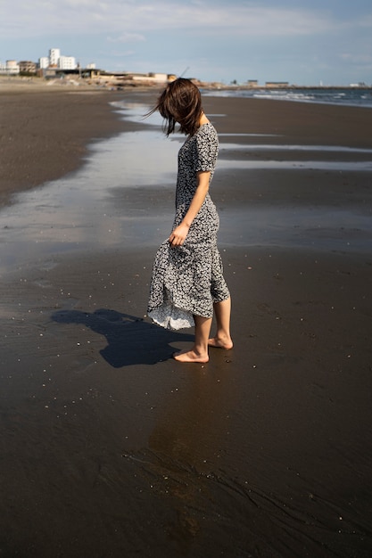 Free Photo | Full shot japanese woman at beach