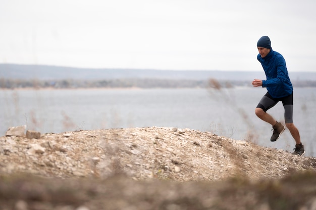 Premium Photo | Full shot young man running on trail