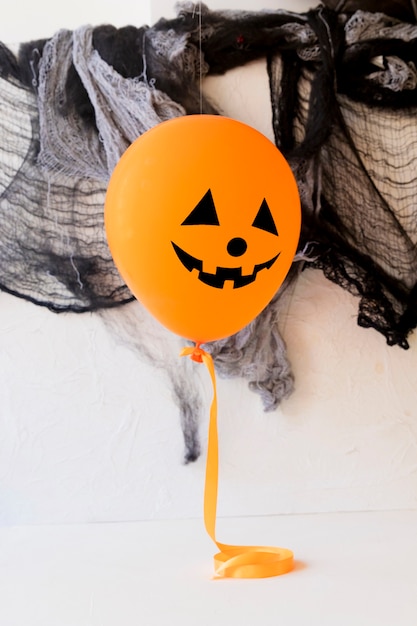 Funny balloon near halloween decorations | Free Photo