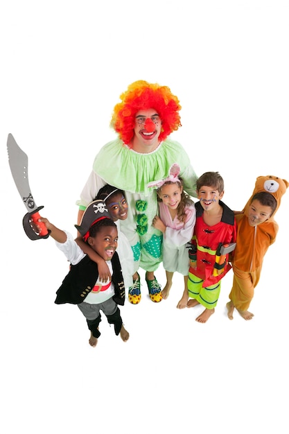 Premium Photo | Funny clown with children in fancy dress