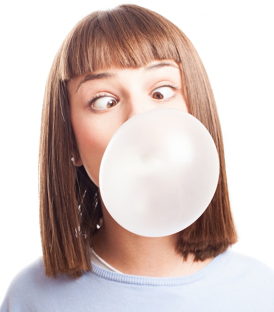 Free Photo | Funny girl doing a bubble with chewing gum