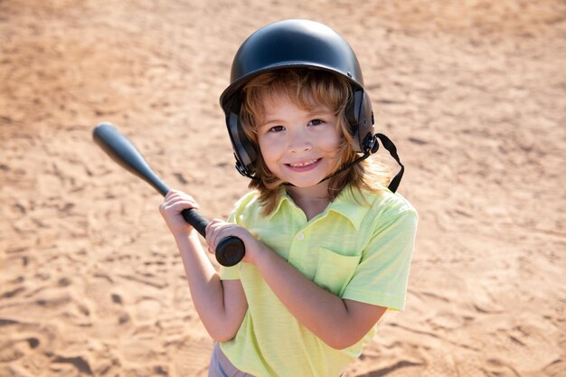 Premium Photo | Funny kid up to bat at a baseball game. close up child ...