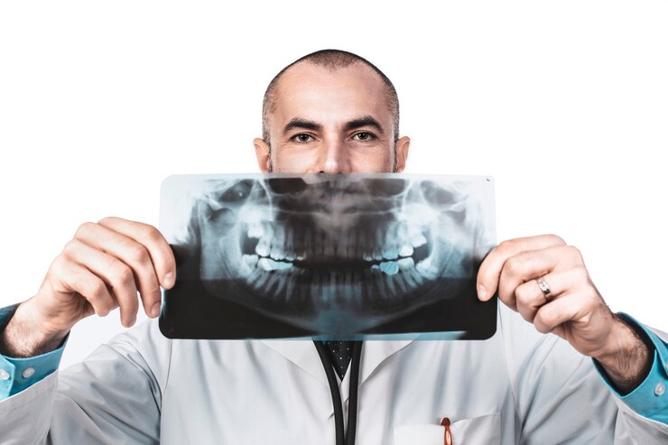  Funny portrait of a dentist doctor holding a panoramic xray Premium Photo