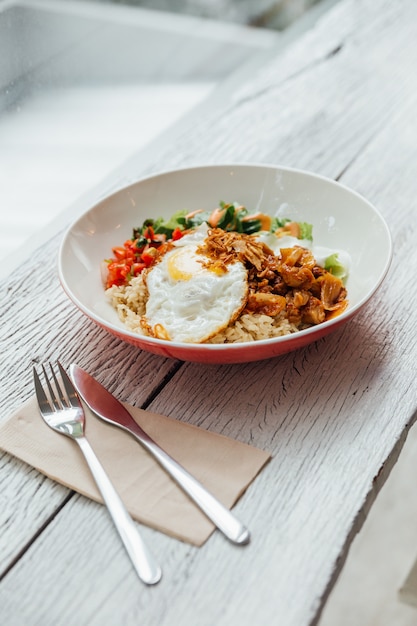 Premium Photo | Fusion food rice bowl toppings kimchi pork, organic ...