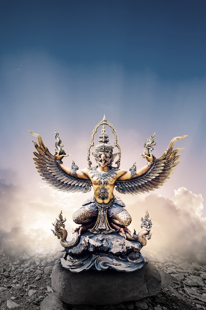 Premium Photo Garuda  statue isolated on clouds and sky 