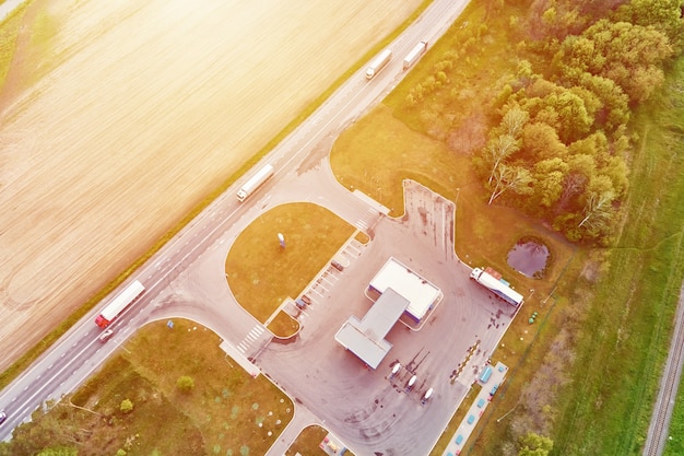 premium-photo-gas-station-near-highway-with-moving-cars-aerial-view