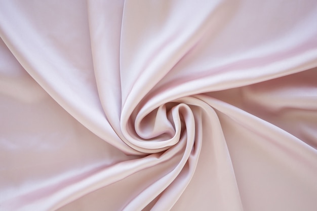 Premium Photo | Gentle pastel pink colored satin folded and flowing ...