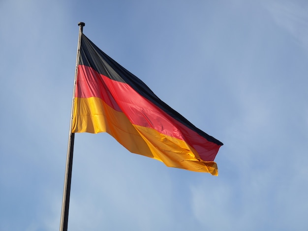 Premium Photo | German flag over blue sky