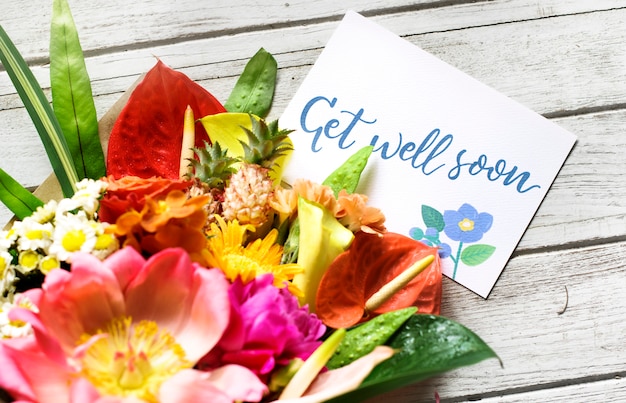 Premium Photo | Get well soon message with bouquet