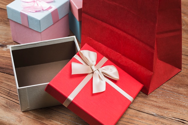 Free Photo | Gift box tied red ribbon with small red hearts printed on ...