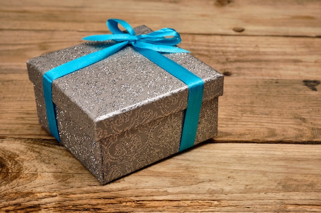 Gift box with blue ribbon Premium Photo