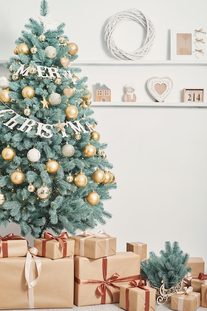 Premium Photo | Gift boxes and decorated christmas tree