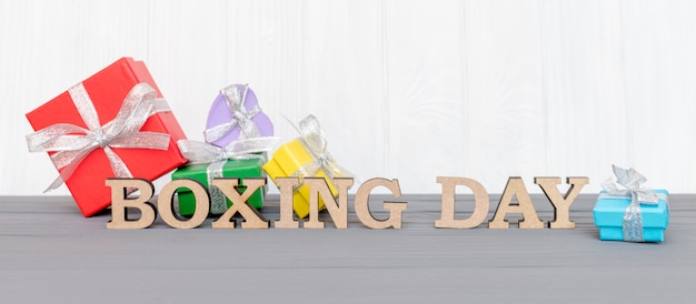 Download Free Gift Boxes Is Tied With A Ribbon With Words Boxing Day On Wood Use our free logo maker to create a logo and build your brand. Put your logo on business cards, promotional products, or your website for brand visibility.