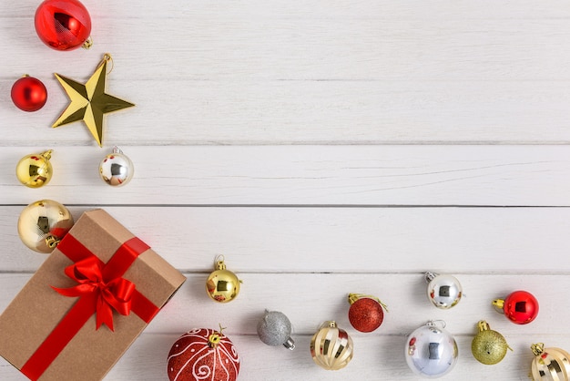 Premium Photo | Gifts boxes with festive ribbons and christmas ornament on white wood