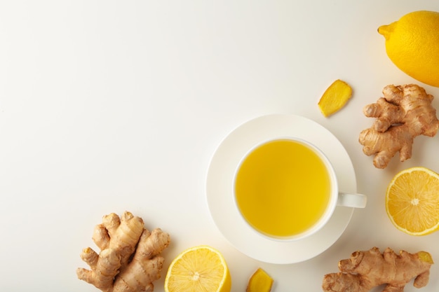 Premium Photo | Ginger tea with lemon and honey on white background.