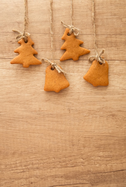 Premium Photo | Gingerbread cookies on a wooden surface. christmas tree ...