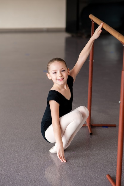 Premium Photo | A girl at a ballet lesson