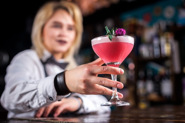 Premium Photo | Girl barman concocts a cocktail at the brasserie