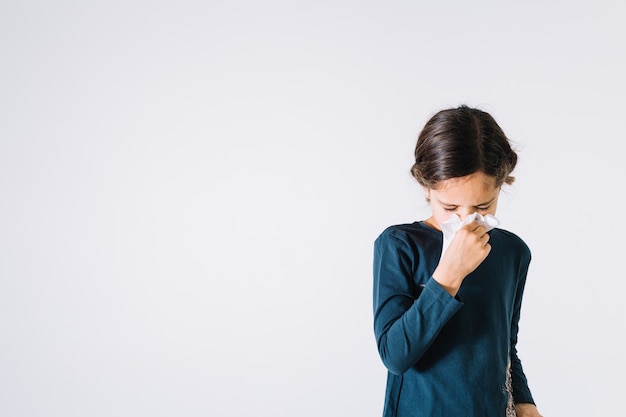 Girl blowing nose Free Photo