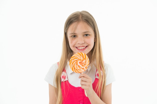 Premium Photo Girl Eating Big Candy On Stick Or Lollipop Sweet Tooth Concept Girl On Smiling Face Holds Giant Colorful Lollipop In Hand Isolated On White Background Kid With Long Hair